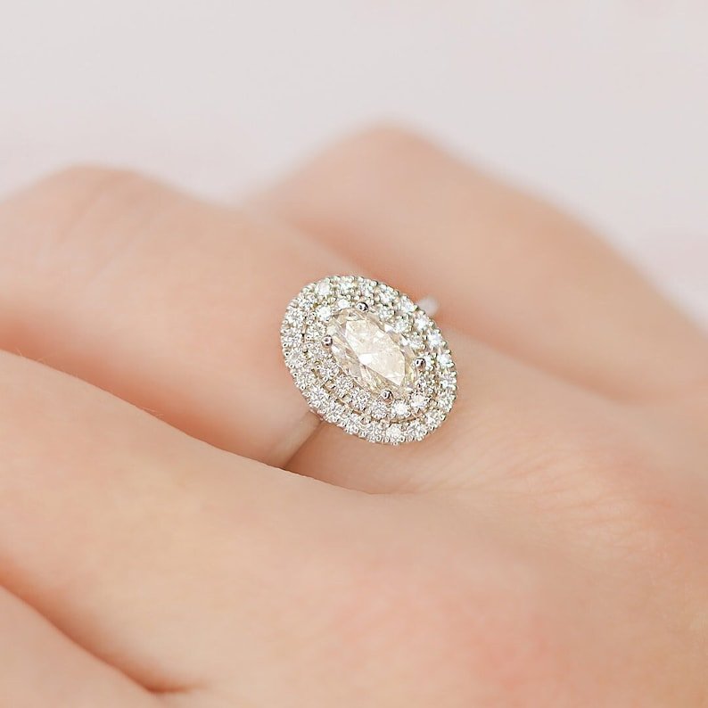 Side angle of oval halo diamond engagement ring