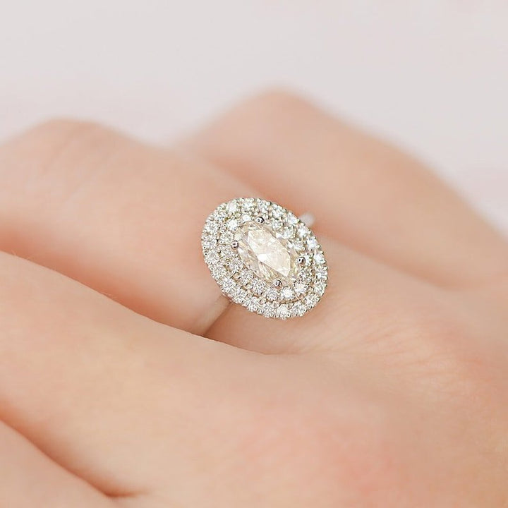 Side angle of oval halo diamond engagement ring