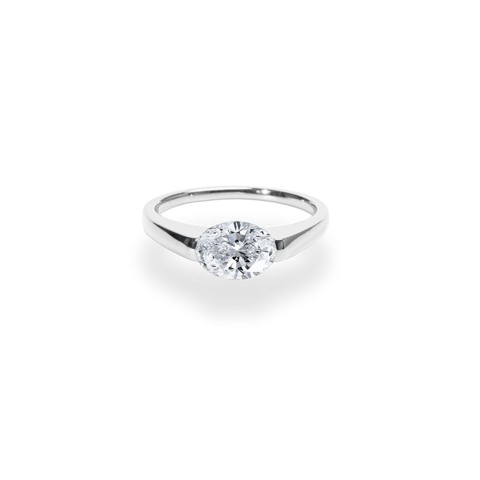 Macro shot of oval cut diamond facets in east west ring setting