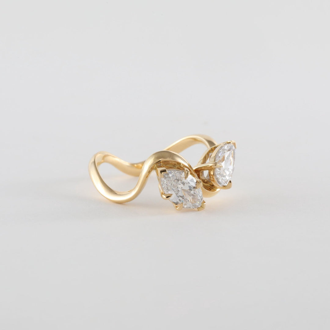 Pear solitaire ring set with an IGI graded diamond