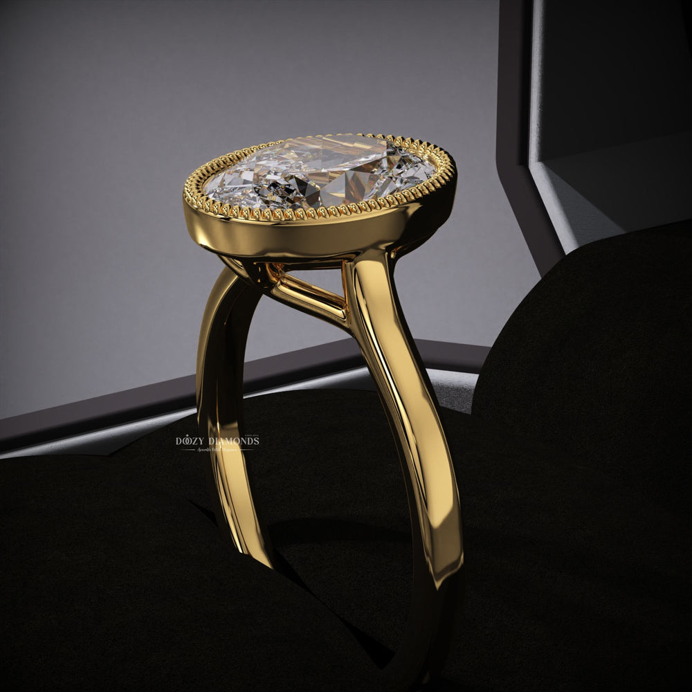 Lifestyle shot of oval bezel diamond ring on hand
