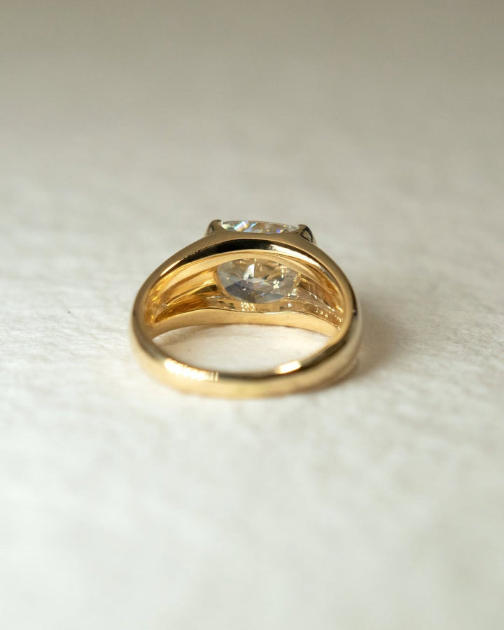 Cushion bezel engagement ring close-up highlighting diamond sparkle