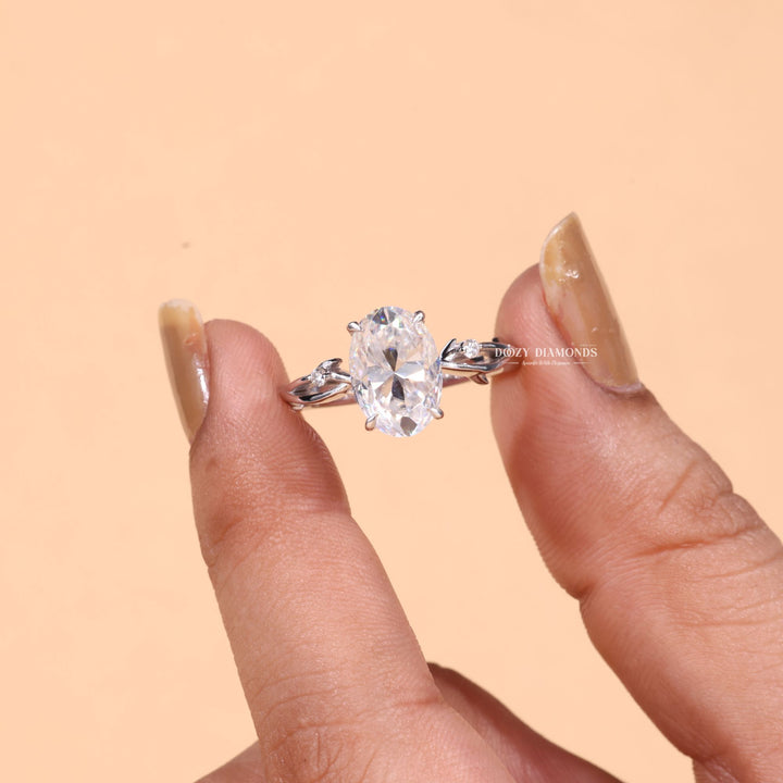 Close-up of oval cut center diamond in solitaire engagement ring