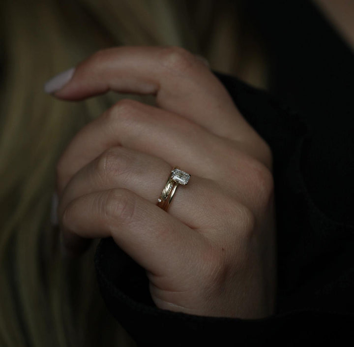 Lifestyle shot of radiant solitaire diamond ring on hand