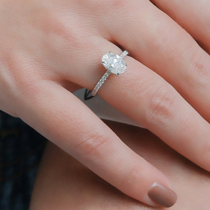 Oval cut diamond ring worn on hand