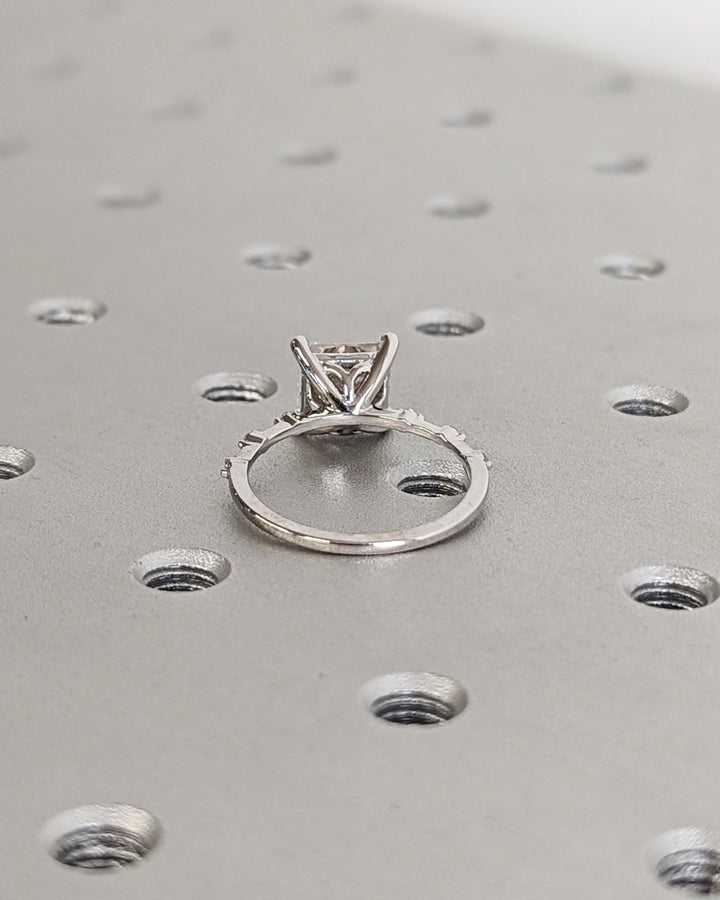 Princess cut pave engagement ring shown in real-life wear
