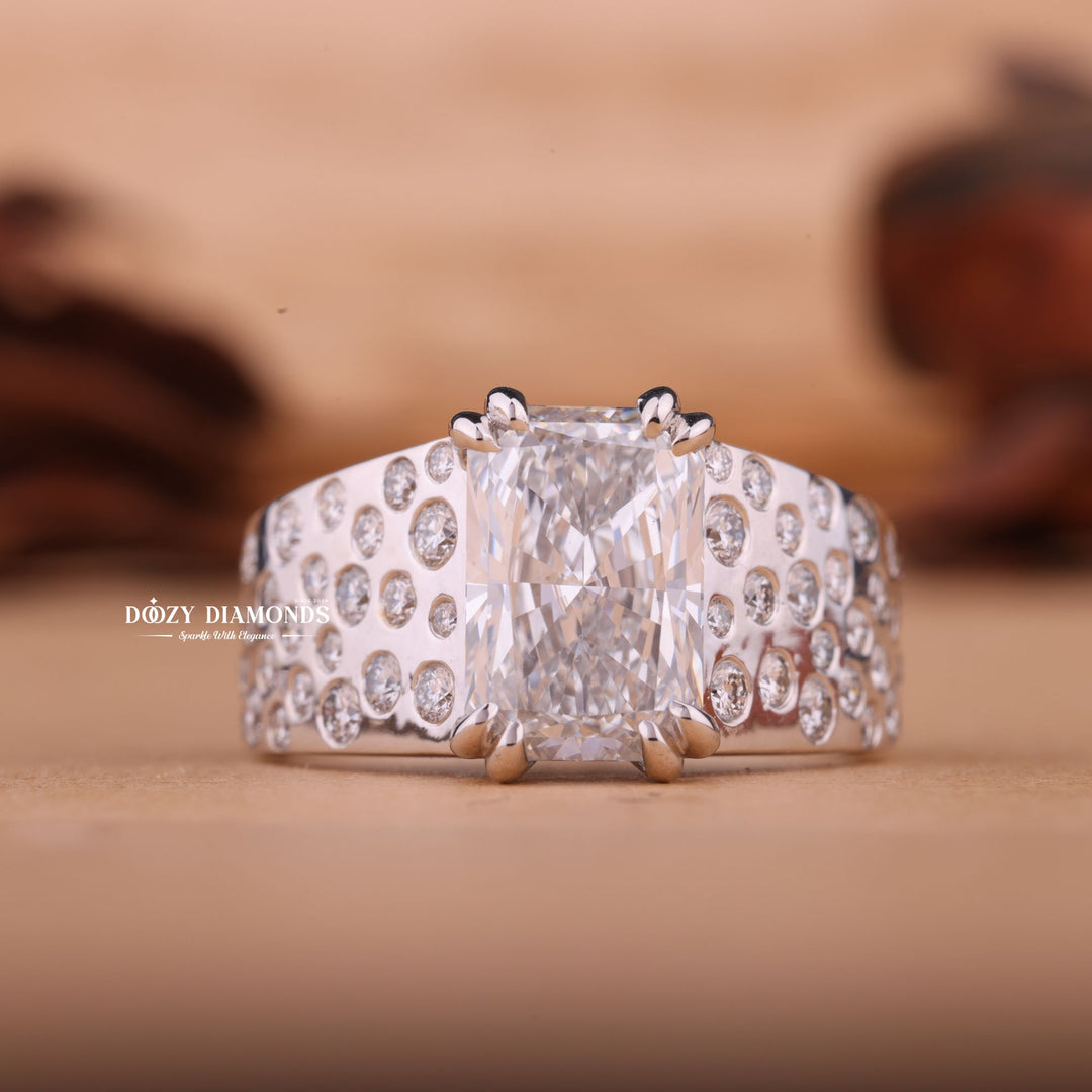 Radiant solitaire diamond ring displayed on jewelry stand