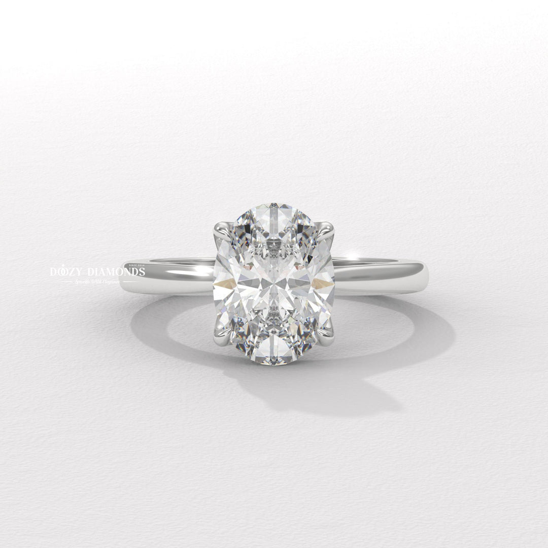 Oval solitaire engagement ring photographed in natural light