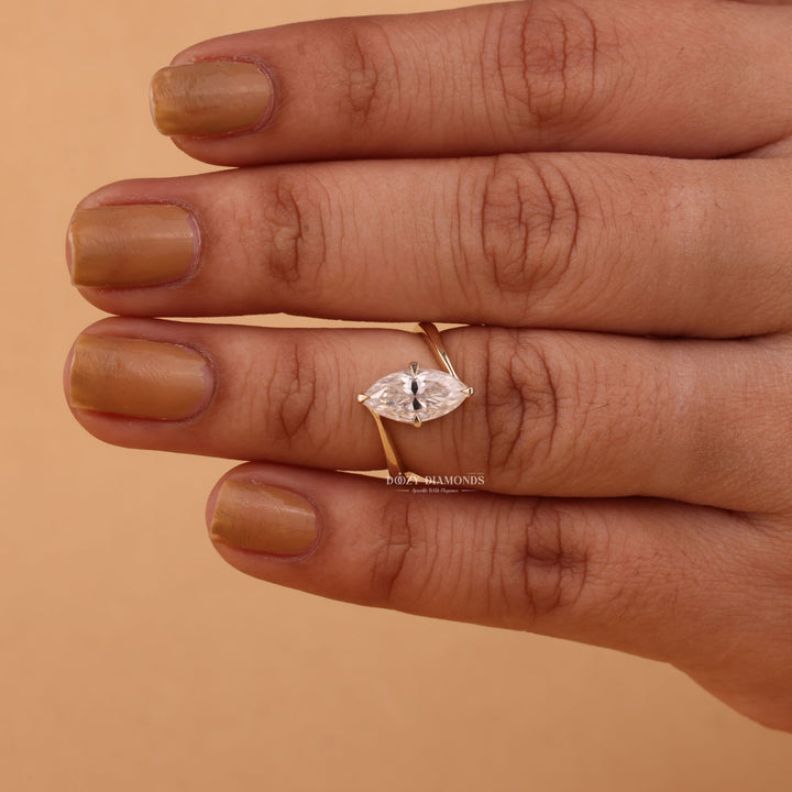 Macro shot of marquise cut diamond facets in solitaire ring setting