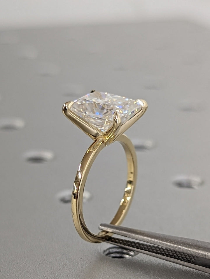 Lifestyle shot of radiant solitaire diamond ring on hand