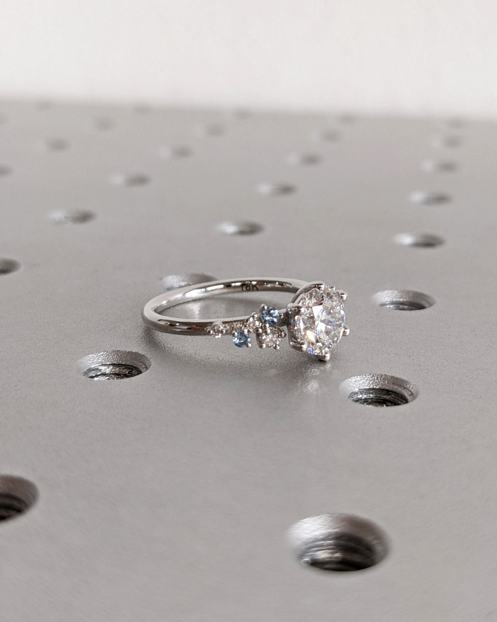 Round cluster engagement ring close-up showing high clarity diamond clarity