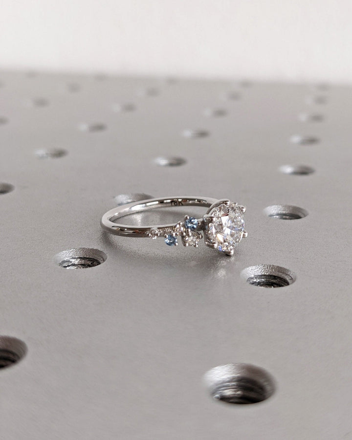 Round cluster engagement ring close-up showing high clarity diamond clarity