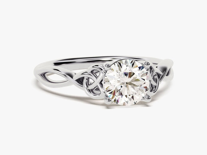 Round art deco diamond ring displayed on jewelry stand
