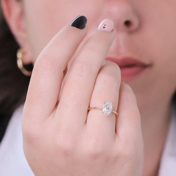 Oval solitaire lab grown diamond ring side profile in gold setting