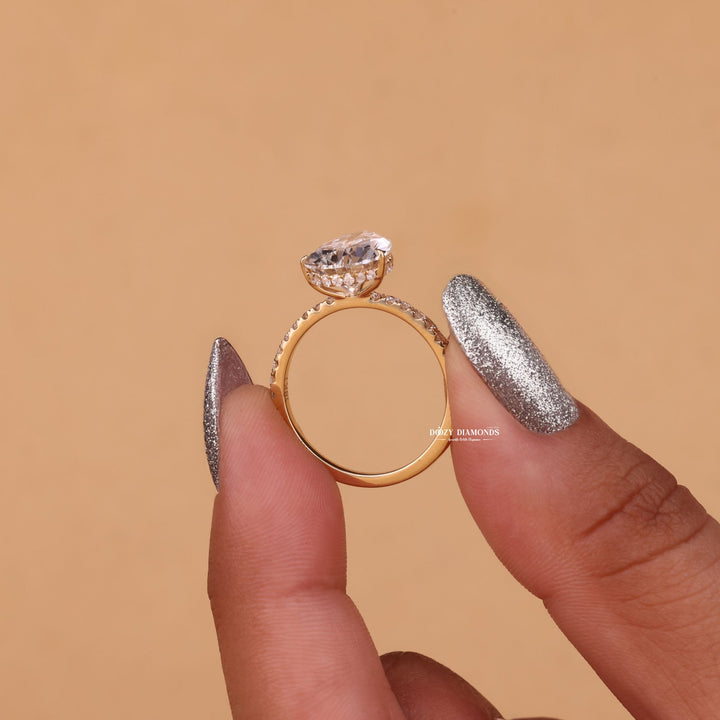 Pear cut engagement ring side view showing band detail