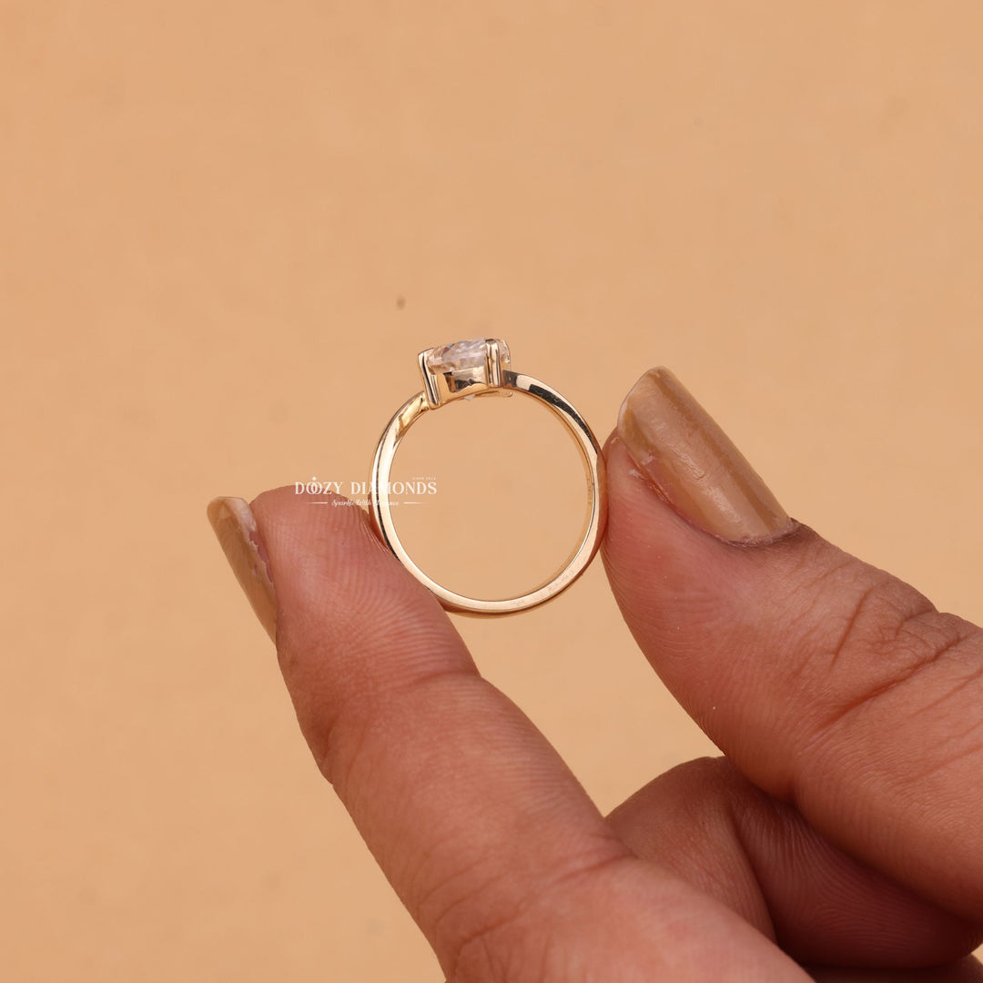 Marquise solitaire lab grown diamond ring side profile in gold setting