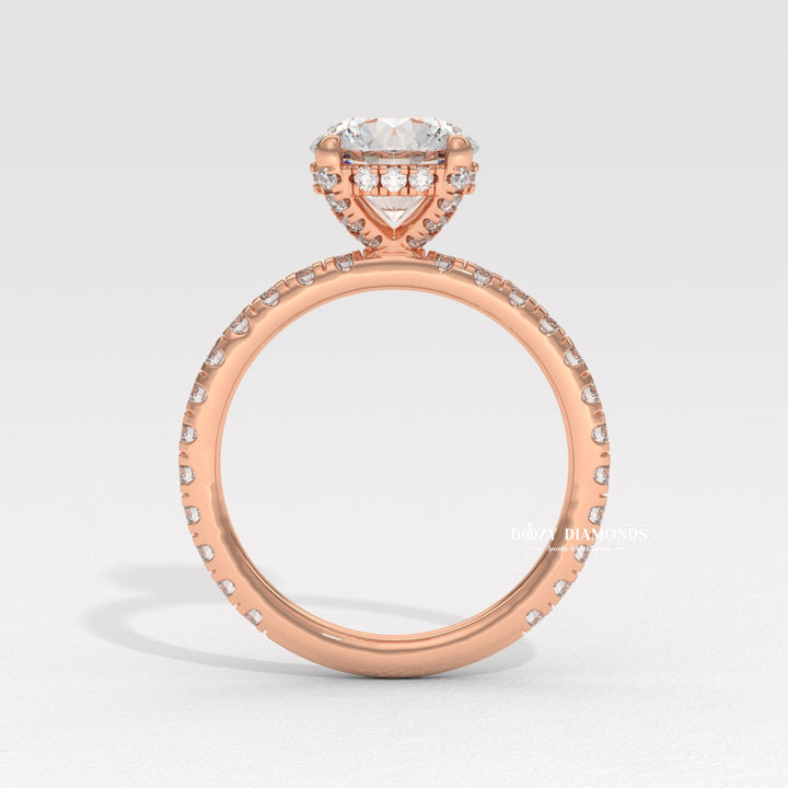Round hidden halo engagement ring photographed in natural light
