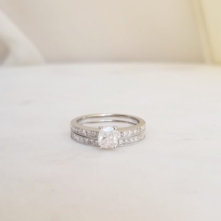 Cushion solitaire engagement ring offered in gold and platinum