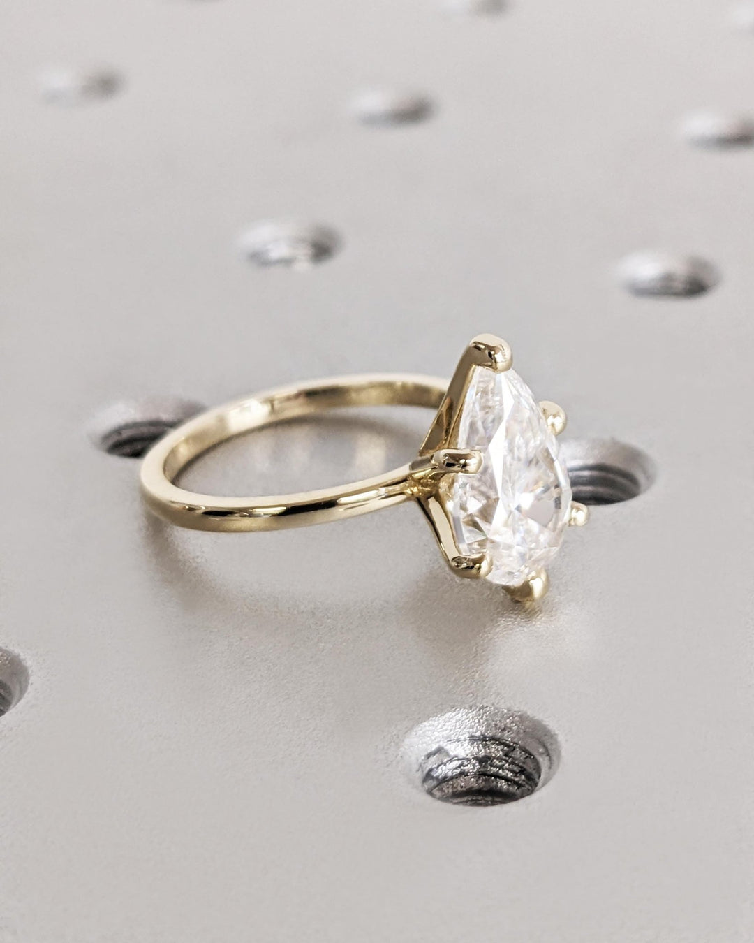 Certified pear cut diamond featured in solitaire engagement ring