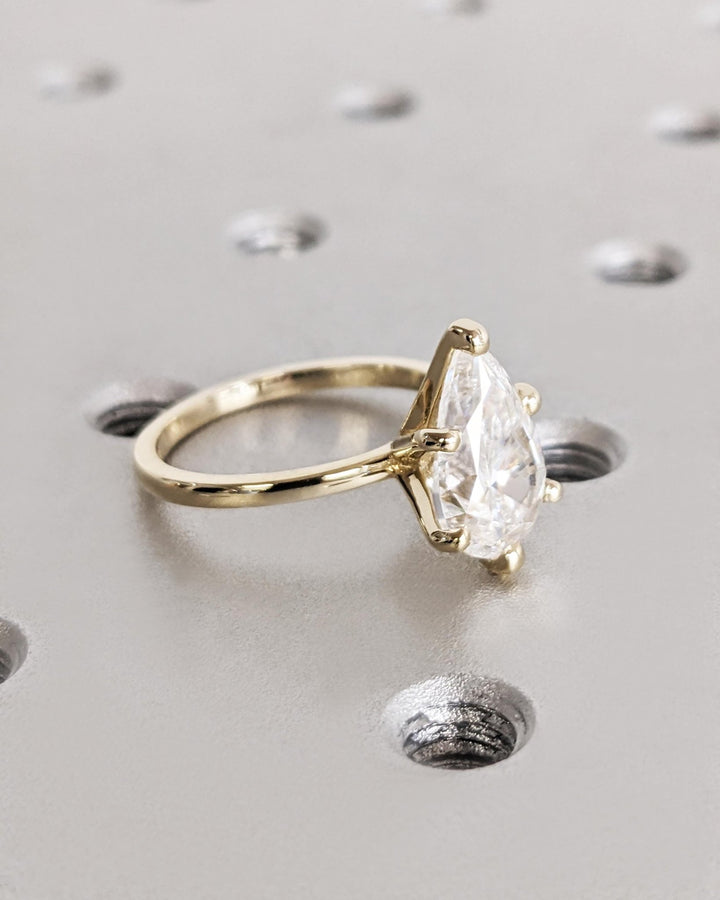 Certified pear cut diamond featured in solitaire engagement ring