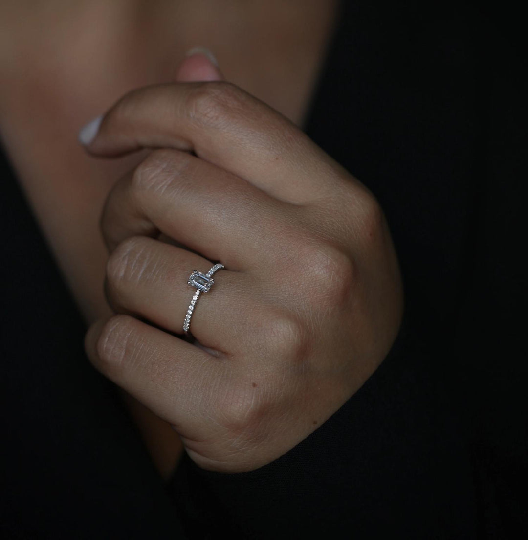 Emerald solitaire diamond engagement ring available in multiple metals