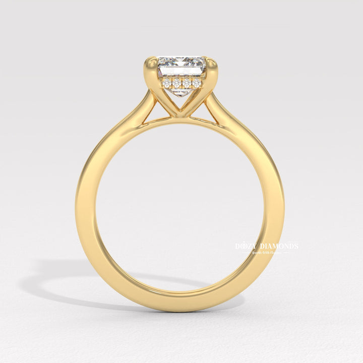 Emerald hidden halo diamond ring presented in signature gift packaging