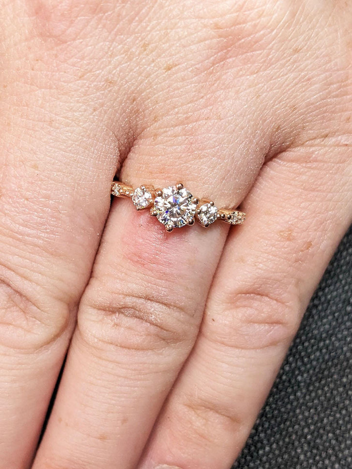 Top-down view of round cut cluster engagement ring