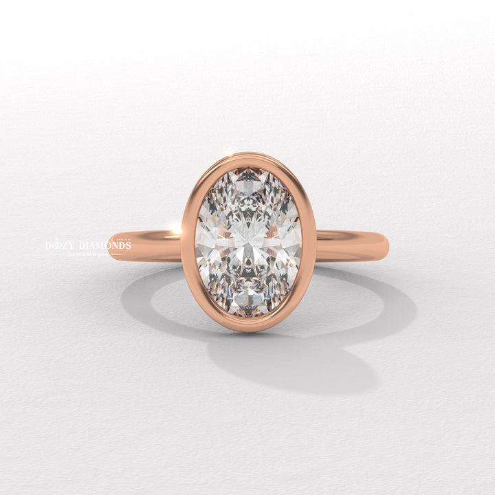 Oval bezel engagement ring photographed in natural light