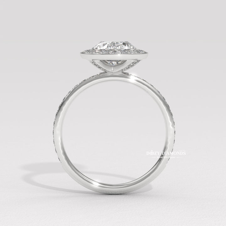 Certified oval cut diamond featured in halo engagement ring