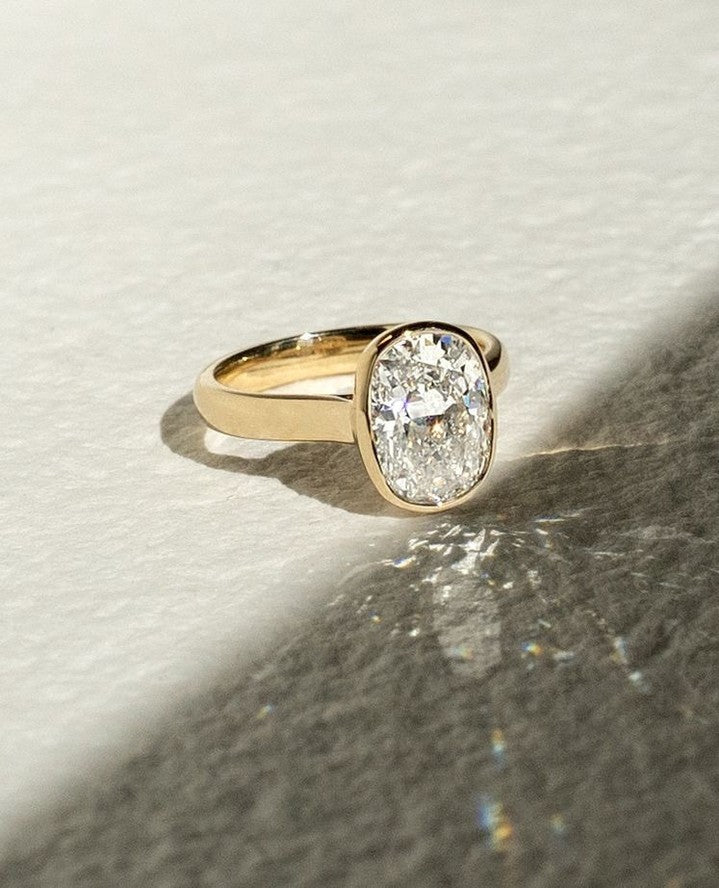 Cushion bezel engagement ring with IGI certificate and packaging