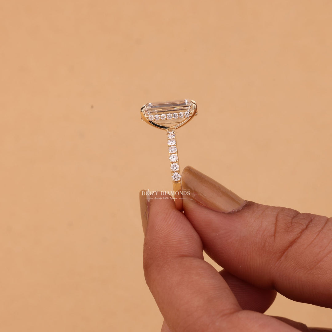 Unboxing view of emerald cut hidden halo diamond engagement ring