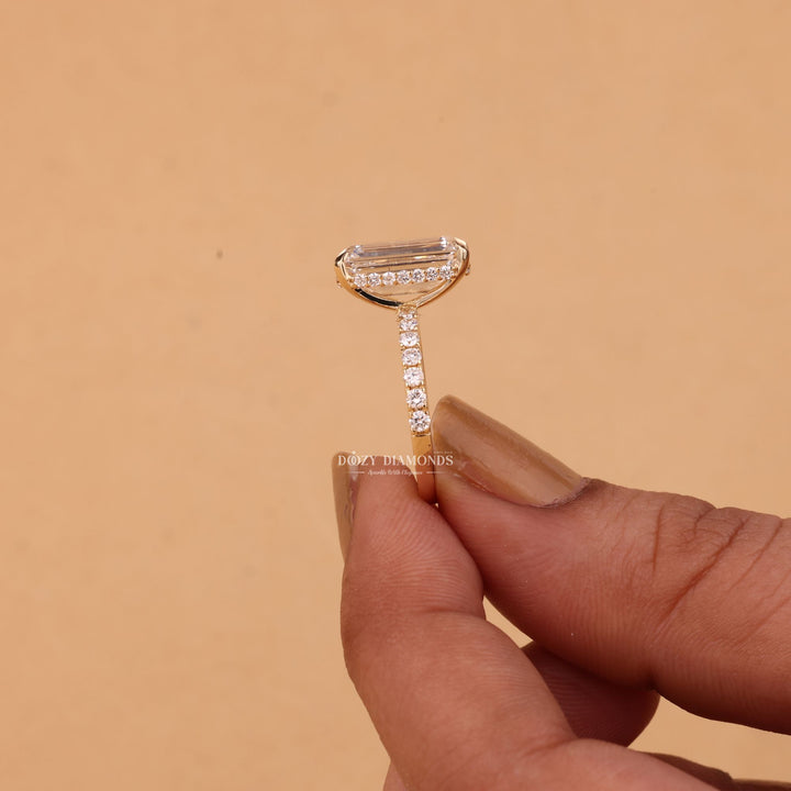 Unboxing view of emerald cut hidden halo diamond engagement ring