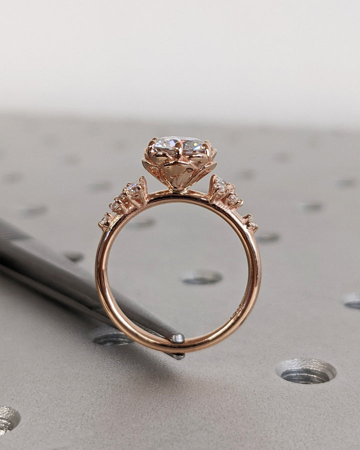 Round cluster lab grown diamond ring fitted on finger