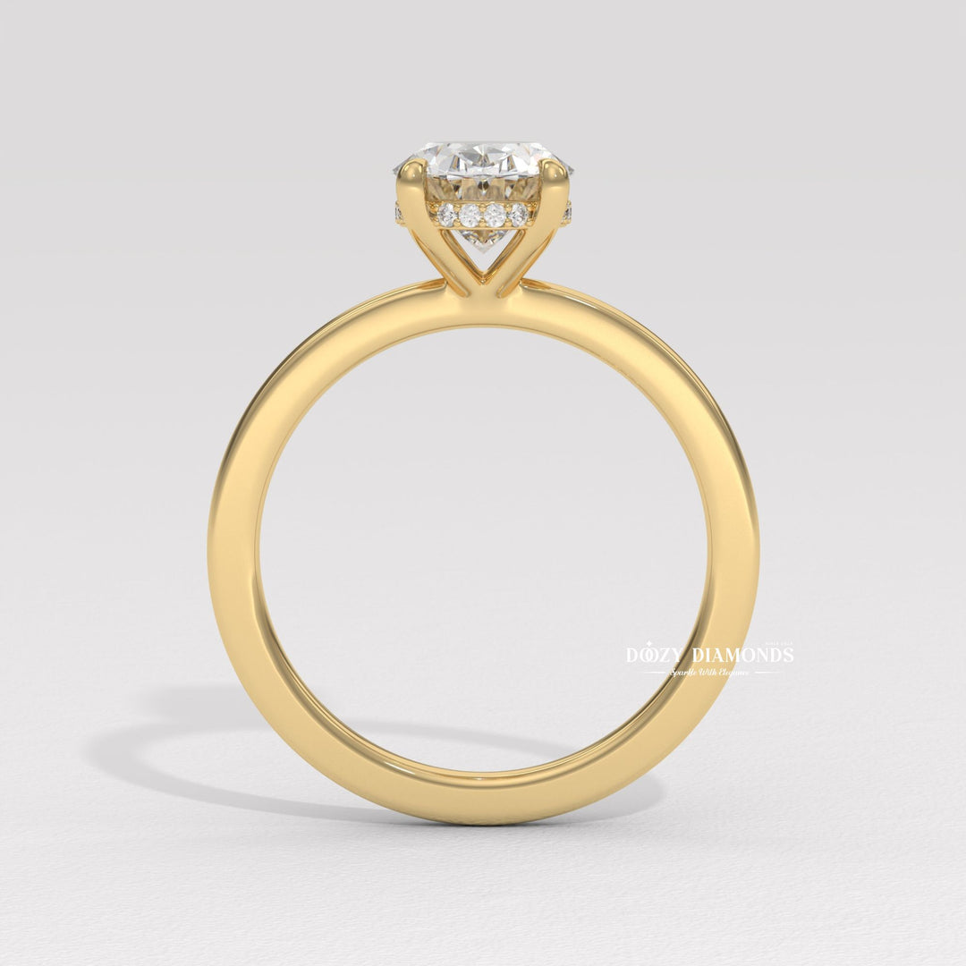 Detailed close-up of oval solitaire diamond engagement ring