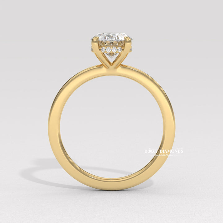 Detailed close-up of oval solitaire diamond engagement ring