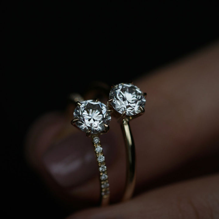 Profile view of round cut solitaire engagement ring band