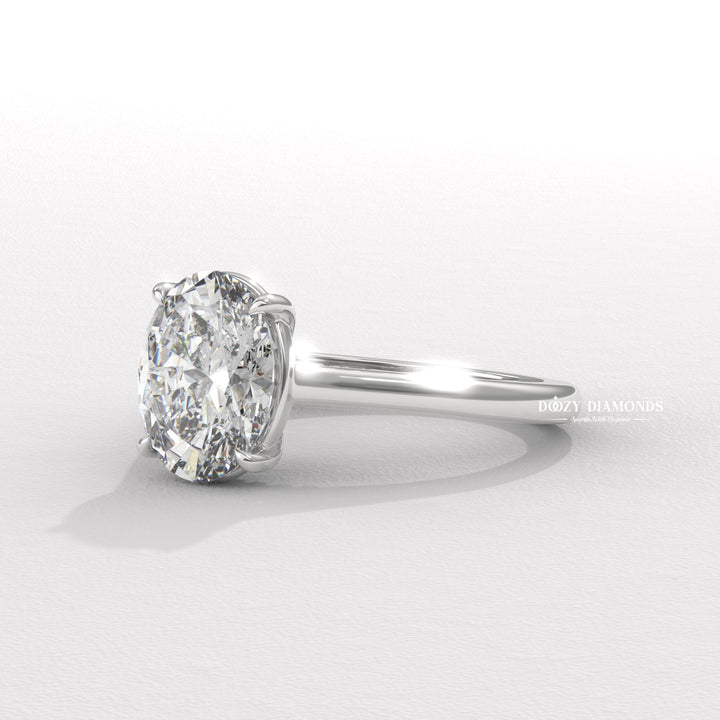 Oval solitaire lab grown diamond ring side profile in gold setting