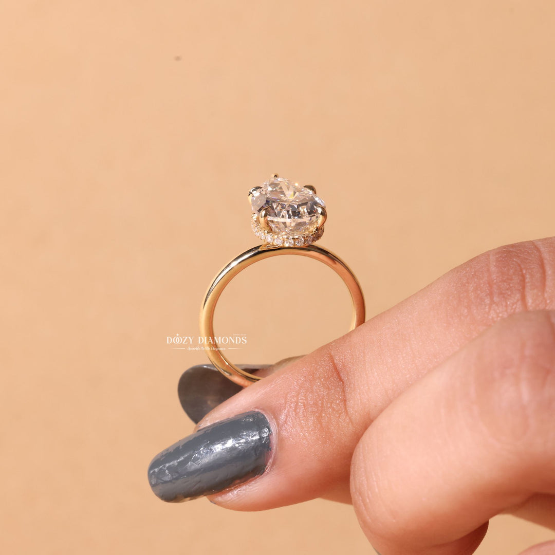 Angled view of pear cut diamond in hidden halo setting