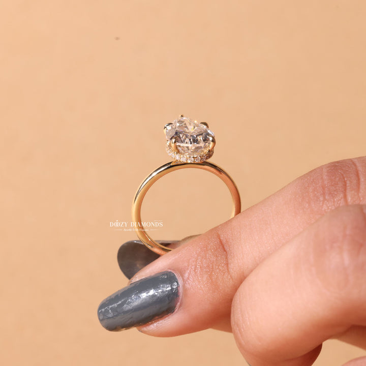 Angled view of pear cut diamond in hidden halo setting