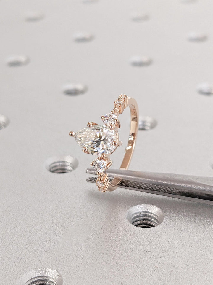 Classic pear cluster engagement ring crafted for everyday wear