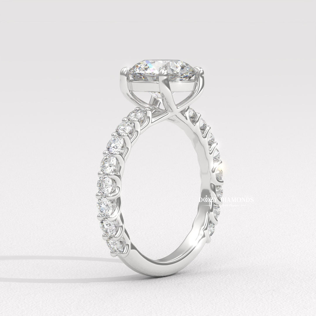 Lifestyle shot of round solitaire diamond ring on hand