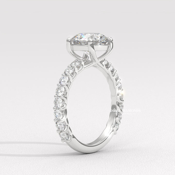 Lifestyle shot of round solitaire diamond ring on hand