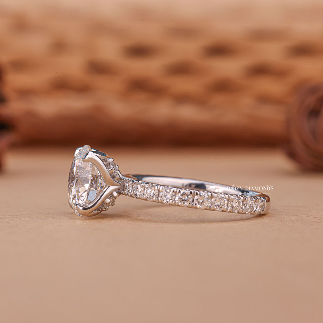 Round solitaire diamond engagement ring available in multiple metals