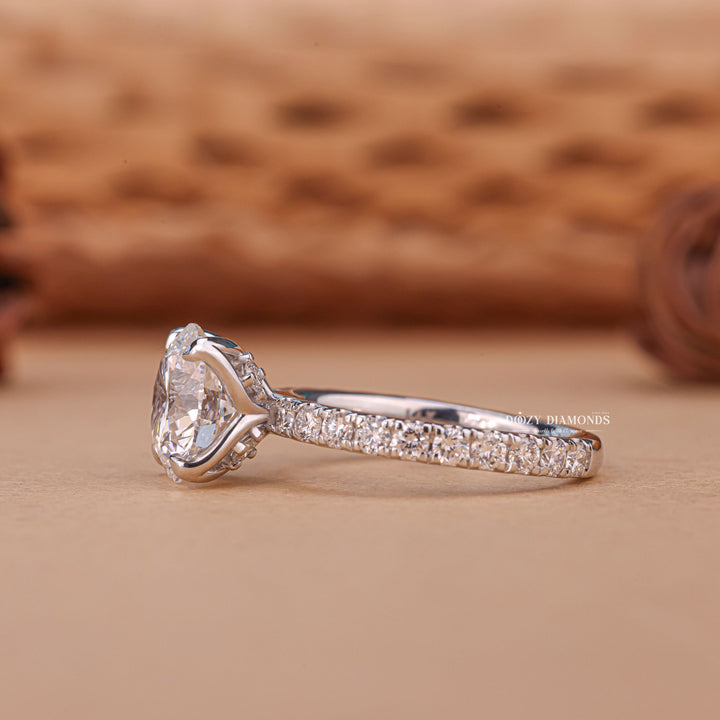 Round solitaire diamond engagement ring available in multiple metals