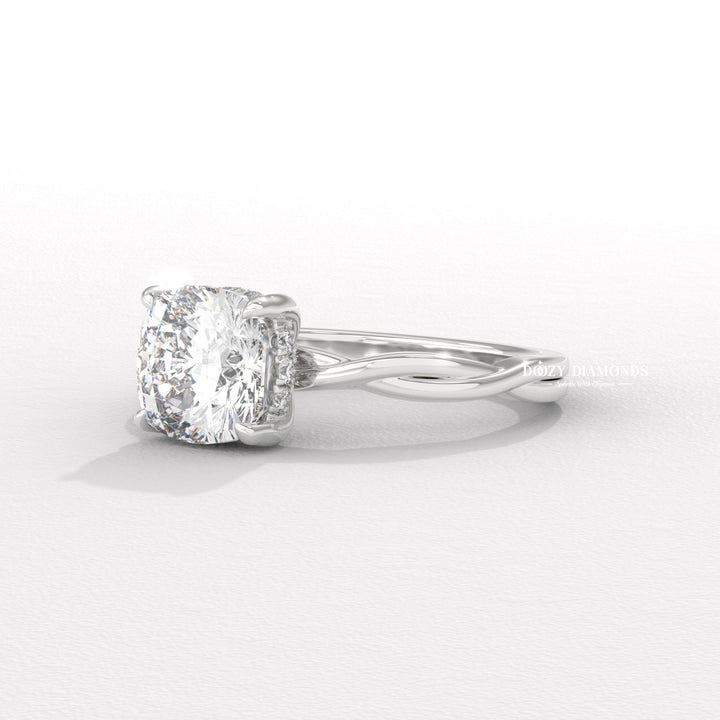 Cushion cut diamond ring worn on hand