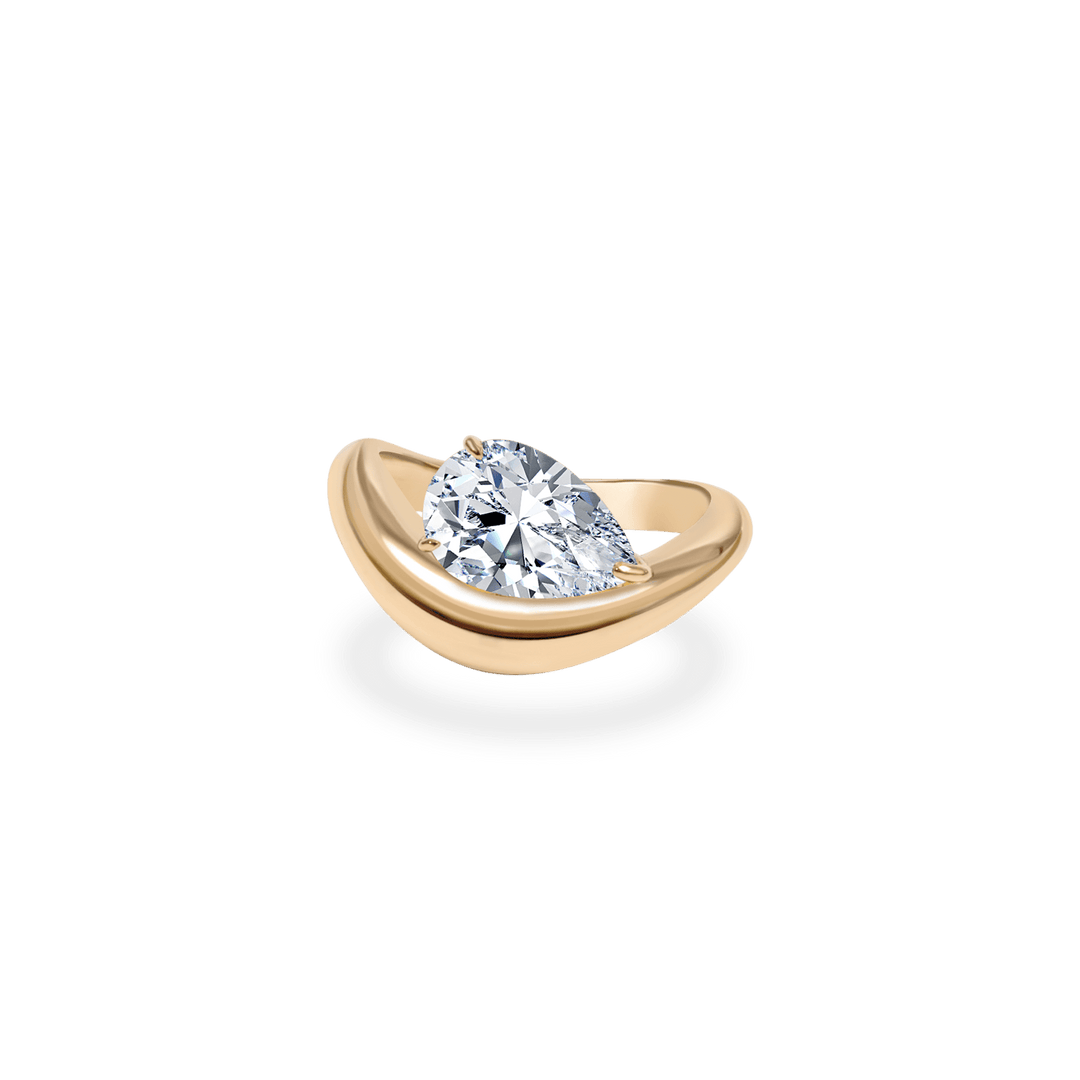 Pear dome engagement ring offered in gold and platinum