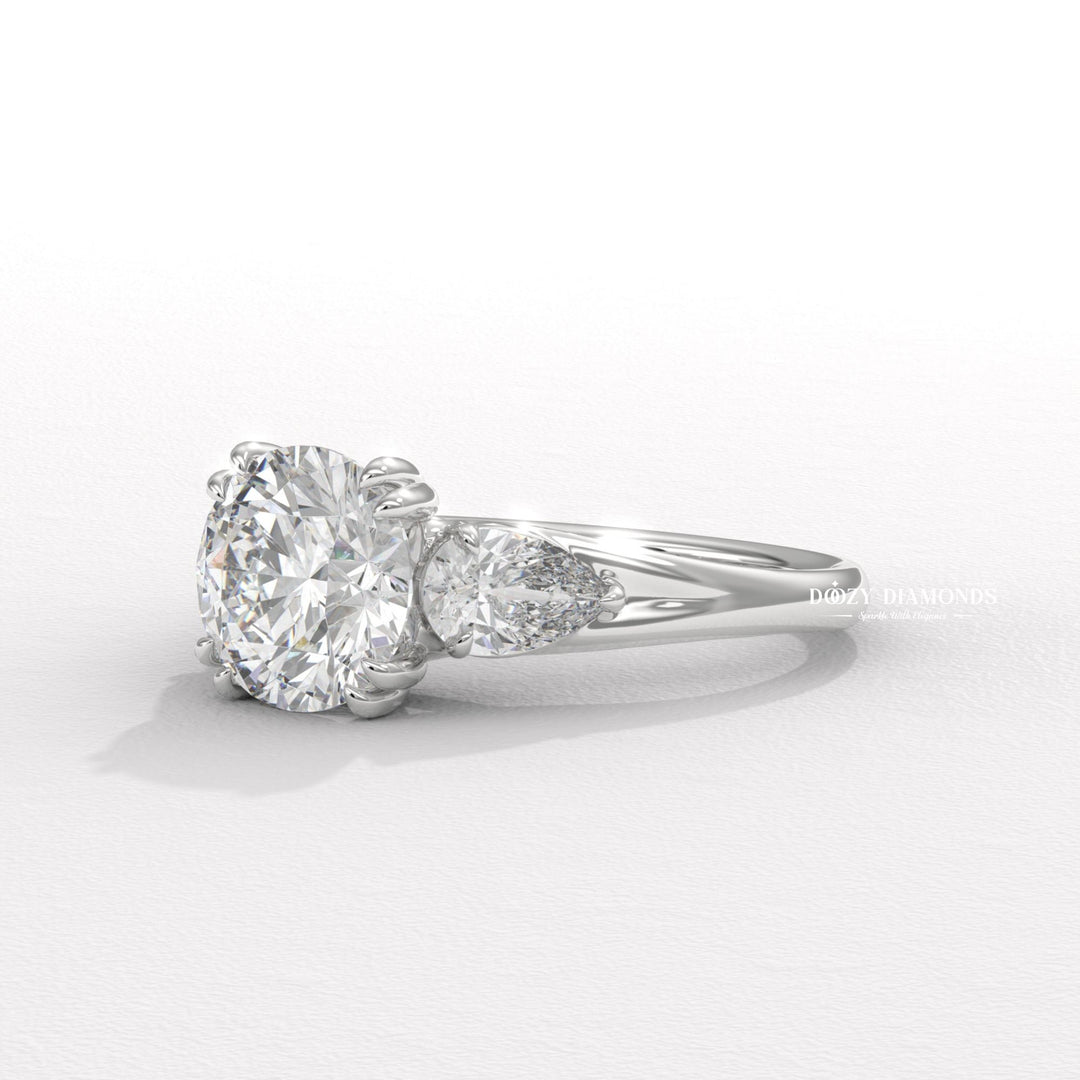 Round three stone engagement ring shown on hand for true-to-life sizing
