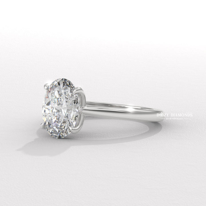 Angled view of oval cut diamond in solitaire setting