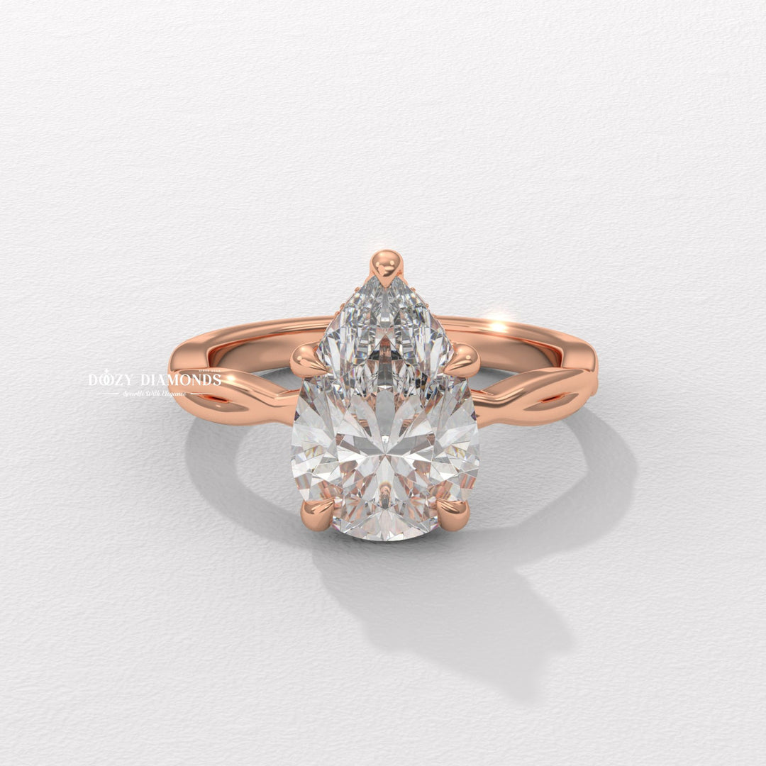 Side angle of pear solitaire diamond engagement ring