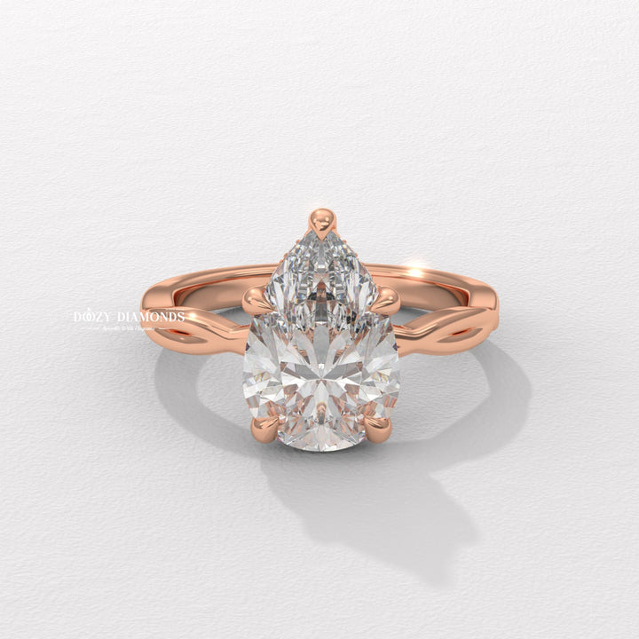 Side angle of pear solitaire diamond engagement ring